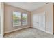 Bedroom with neutral walls, carpet, and large windows at 320 Ibisview Lane # 33572, Apollo Beach, FL 33572