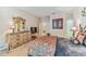 Bright bedroom with a floral comforter and TV at 320 Ibisview Lane # 33572, Apollo Beach, FL 33572