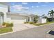 Attached garage with light-beige door and concrete driveway at 320 Ibisview Lane # 33572, Apollo Beach, FL 33572