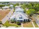 Aerial view of house with metal roof and landscaping at 320 Ibisview Lane # 33572, Apollo Beach, FL 33572