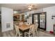 Dining room with wooden table and French doors at 3736 Lado Dr, Wesley Chapel, FL 33543