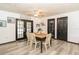 Dining area with wooden table and French doors at 3736 Lado Dr, Wesley Chapel, FL 33543