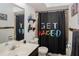 Clean bathroom with shower/tub combo and a unique shower curtain at 3736 Lado Dr, Wesley Chapel, FL 33543