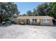 Brick ranch home with welcoming front porch at 3736 Lado Dr, Wesley Chapel, FL 33543