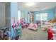 Charming bedroom with playful decor and ample storage at 3736 Lado Dr, Wesley Chapel, FL 33543