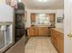Kitchen with wood cabinets and tile floor at 3736 Lado Dr, Wesley Chapel, FL 33543
