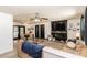 Living room with fireplace and large TV at 3736 Lado Dr, Wesley Chapel, FL 33543
