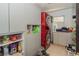 Functional laundry room, includes washer, dryer, and storage cabinets at 3736 Lado Dr, Wesley Chapel, FL 33543