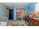 Organized bedroom with built-in closet and playful decor at 3736 Lado Dr, Wesley Chapel, FL 33543