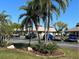 Community view showcasing palm trees and building exteriors at 4329 Tahitian Gardens Cir # B, Holiday, FL 34691