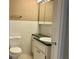 Clean bathroom with vanity, toilet, and tiled walls at 4329 Tahitian Gardens Cir # B, Holiday, FL 34691