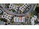 Aerial view of a condo community with well-maintained landscaping and ample parking at 4329 Tahitian Gardens Cir # B, Holiday, FL 34691