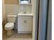 Cozy bathroom with white fixtures, including a toilet and vanity at 4329 Tahitian Gardens Cir # B, Holiday, FL 34691