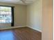 Bright bedroom with laminate flooring, ample natural light, and neutral paint, creating a peaceful and inviting space at 4329 Tahitian Gardens Cir # B, Holiday, FL 34691