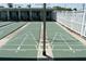 Well-maintained shuffleboard courts with clear markings and covered seating at 4329 Tahitian Gardens Cir # B, Holiday, FL 34691