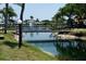 Serene water view with a charming bridge. Perfect for enjoying peaceful walks at 4329 Tahitian Gardens Cir # B, Holiday, FL 34691