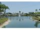 Beautiful water view with fountain and lush green surroundings. Palm trees add to the tropical ambiance at 4329 Tahitian Gardens Cir # B, Holiday, FL 34691