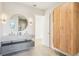 Bathroom featuring double sink, marble countertop, modern fixtures, and an adjacent wardrobe at 1630 Douglas Ave, Dunedin, FL 34698