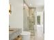 Modern bathroom featuring marble vanity, glass-enclosed shower, and elegant fixtures with clean lines and bright lighting at 1630 Douglas Ave, Dunedin, FL 34698