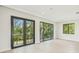 The bedroom has expansive windows providing generous natural light and outdoor views at 1630 Douglas Ave, Dunedin, FL 34698