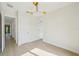 Bedroom with hardwood flooring, modern light fixture, and white trim at 1630 Douglas Ave, Dunedin, FL 34698