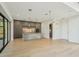 Modern kitchen with island, stainless steel appliances, and grey cabinets at 1630 Douglas Ave, Dunedin, FL 34698