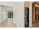 Laundry area featuring stackable washer and dryer and built in wooden cabinet and shelves at 1630 Douglas Ave, Dunedin, FL 34698