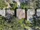Aerial view of a home with a pool and lush landscaping at 1630 Douglas Ave, Dunedin, FL 34698