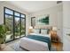 Bedroom with large windows and hardwood floors at 1630 Douglas Ave, Dunedin, FL 34698