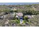 Aerial view of a modern home with bay views and a spacious backyard at 1630 Douglas Ave, Dunedin, FL 34698