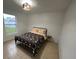 Bedroom with a queen bed, tiled floors, and a window with backyard view at 2510 Sheila Ln, North Port, FL 34286
