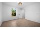 Bright bedroom with tile floors and a view of the backyard at 2510 Sheila Ln, North Port, FL 34286