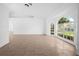 Living room with large windows and tile floors at 2510 Sheila Ln, North Port, FL 34286
