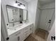 Bright bathroom with double vanity and updated fixtures at 2510 Sheila Ln, North Port, FL 34286