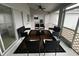 Relaxing screened porch with patio furniture and view of backyard at 2510 Sheila Ln, North Port, FL 34286