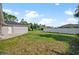 Spacious backyard with a large grassy area at 2510 Sheila Ln, North Port, FL 34286