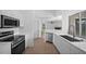 Modern kitchen with stainless steel appliances and white cabinets at 2510 Sheila Ln, North Port, FL 34286