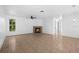 Living room with tile floors and a cozy fireplace at 2510 Sheila Ln, North Port, FL 34286