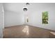 Bright bedroom with tile flooring and large window at 2510 Sheila Ln, North Port, FL 34286