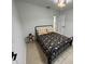 Cozy bedroom with a full-size bed and charming decor at 2510 Sheila Ln, North Port, FL 34286
