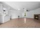 Spacious living room with fireplace and tiled floors at 2510 Sheila Ln, North Port, FL 34286
