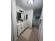 Bathroom with double vanity, a large mirror, and a bathtub at 2510 Sheila Ln, North Port, FL 34286