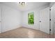 Bright bedroom with tile flooring and large window at 2510 Sheila Ln, North Port, FL 34286