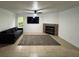 Living room featuring a fireplace, tiled floors, and comfortable seating at 2510 Sheila Ln, North Port, FL 34286