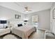 Spacious main bedroom with a king-size bed and updated flooring at 8901 Blind Pass Rd # 228, St Pete Beach, FL 33706