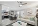 Open floor plan with white couch and gray kitchen at 8901 Blind Pass Rd # 228, St Pete Beach, FL 33706
