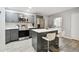 Updated kitchen featuring stainless steel appliances and gray cabinets at 8901 Blind Pass Rd # 228, St Pete Beach, FL 33706