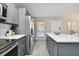 Modern kitchen with stainless steel appliances and an island at 8901 Blind Pass Rd # 228, St Pete Beach, FL 33706