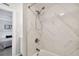 Modern bathroom with a marble shower and bathtub at 8901 Blind Pass Rd # 228, St Pete Beach, FL 33706