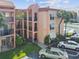 Two-story building with red tile roofs and balconies at 8901 Blind Pass Rd # 228, St Pete Beach, FL 33706